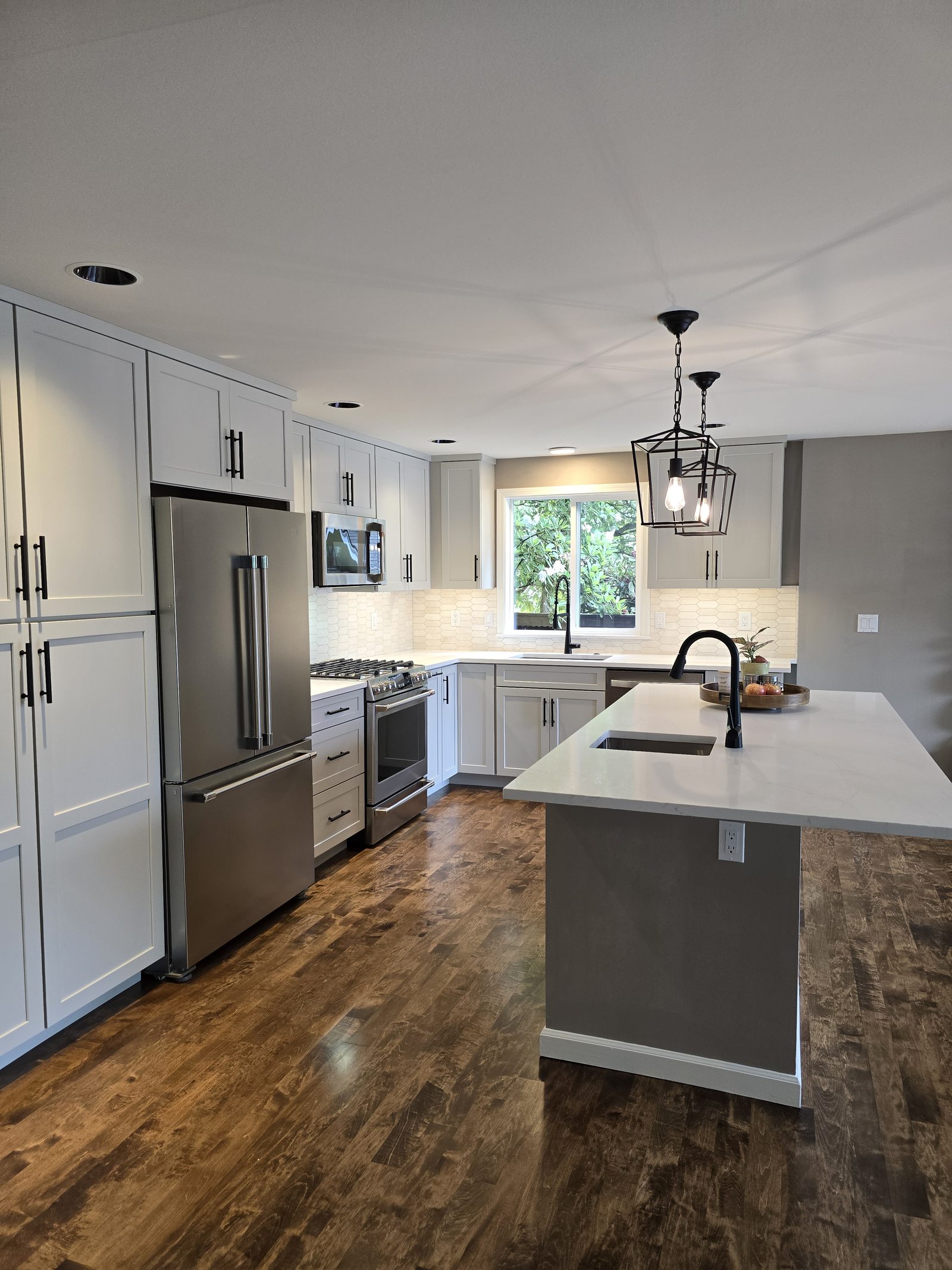 Wide kitchen shot with stainless appliances