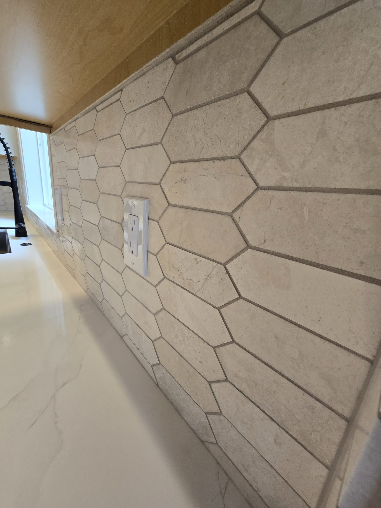 Stovetop detail with quartz and backsplash